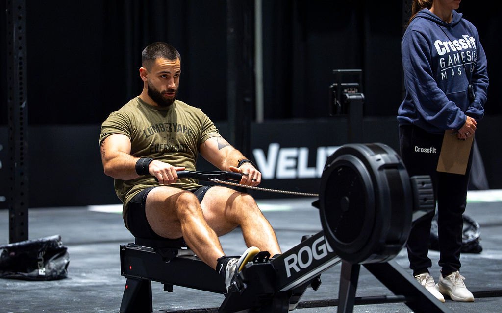 Athlete mid-stroke on a rower at the 2026 CrossFit Games